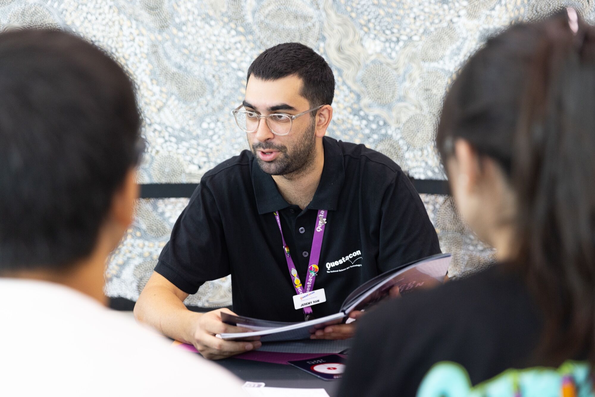 Male Questacon Employee with glasses leading cyber workshop