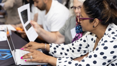 Two women working on a laptop