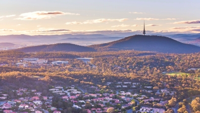 Landscape photo of Canberra including suburban homes and Black Mountain Tower