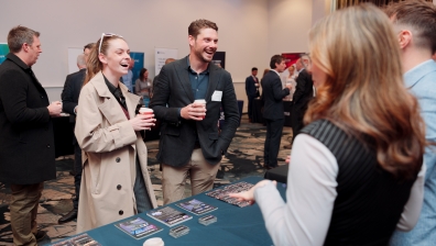 Photo of members networking before event